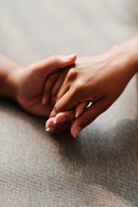 holding hands in support